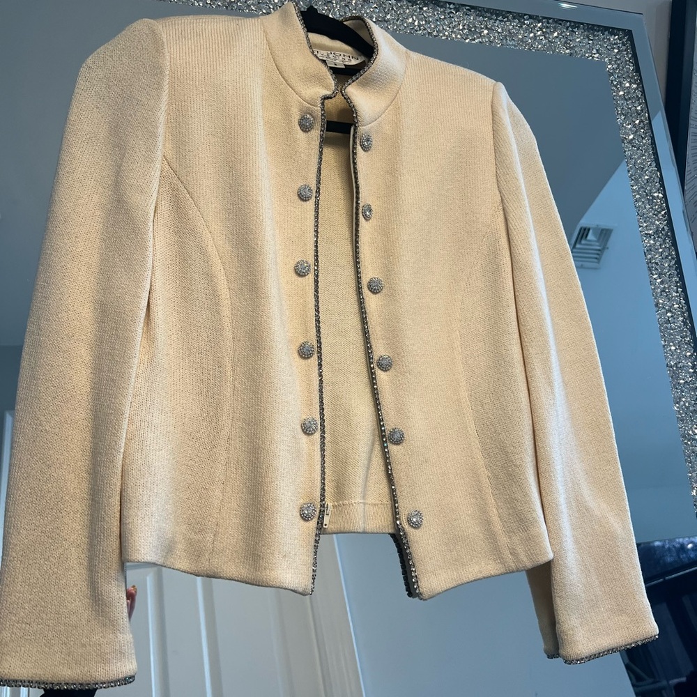 St. John size 2 knit jacket with rhinestones and zipper closure.